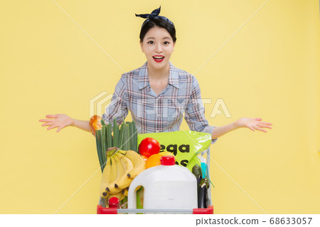 Life style concept, happy shopping time. Young asian woman with shopping bags and cart. 438 68633057