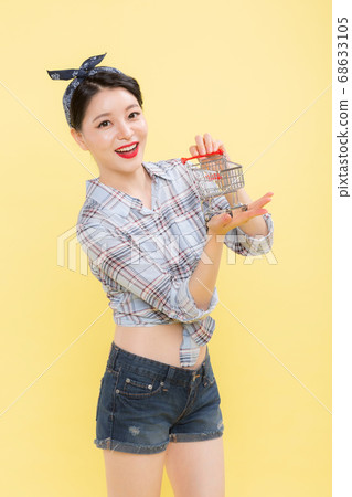 Life style concept, happy shopping time. Young asian woman with shopping bags and cart. 424 68633105