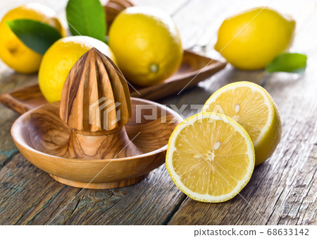 Lemons and squeezer . Lemons and squeezer . 68633142