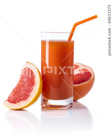 Glass of fresh grapefruit juice and cut fruits 68633375