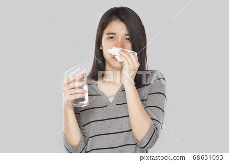 young asian woman feel have fever and sick young asian woman feel have fever and sick 68634093