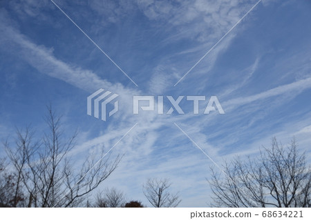Clouds in the sky and contrails 68634221