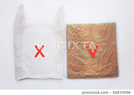 Blank plastic bag vs brown recyclable paper pack. Blank plastic bag vs brown recyclable paper pack. 68634996