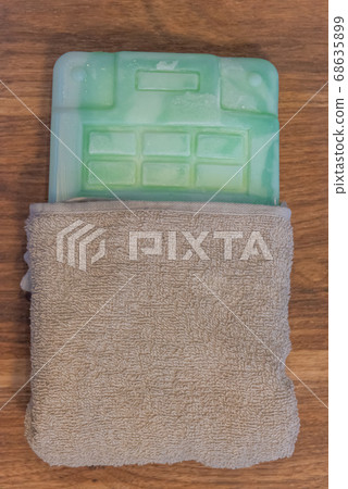 Ice pack wrapped in towel Ice pack wrapped in towel 68635899