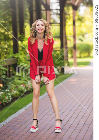 joyful business woman in a red business suit, joyful business woman in a red business suit, 68638025