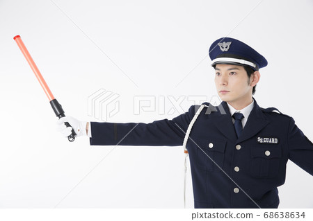 Guardman who guides traffic Guardman who guides traffic 68638634