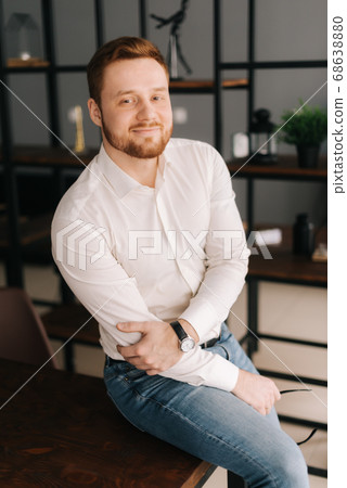 Smiling young business man wearing stylish glasses in trendy clothing looking away 68638880