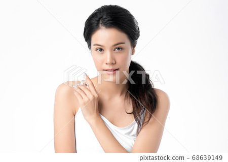 Beautiful Young asian Woman with Clean Fresh Skin, on white background, Face care, Facial treatment. Beautiful Young asian Woman with Clean Fresh Skin, on white background, Face care, Facial treatment. 68639149