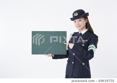 Female police officer with blackboard Female police officer with blackboard 68639758
