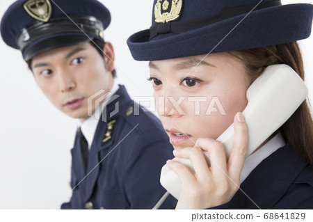 Police officer receiving a call Police officer receiving a call 68641829