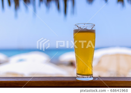 Glass of cold beer at the beach bar 68641968