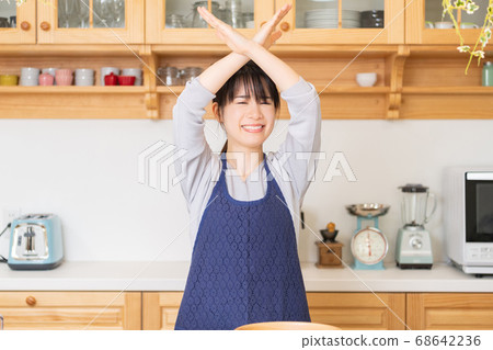 Young woman making NG sign Young woman making NG sign 68642236