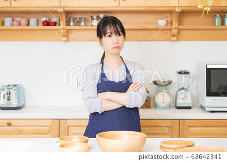 Young woman with arms folded 68642341