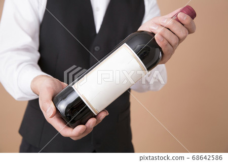 Sommelier with wine 68642586