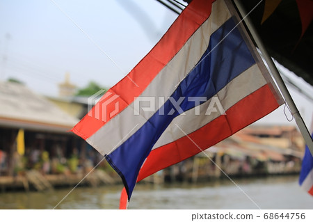 waving Thailand flag at outdoor with water market background waving Thailand flag at outdoor with water market background 68644756