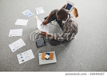 Businessman examining the charts Businessman examining the charts 68646087