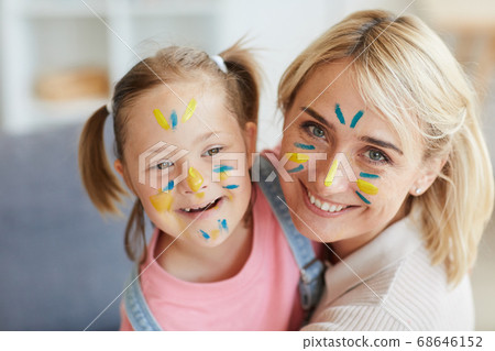 Family with painted faces 68646152