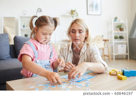 Family collecting puzzles 68646197