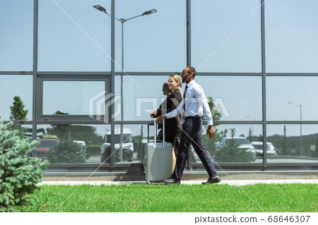 Meeting of young business partners after arriving to end point of business trip 68646307