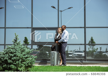 Meeting of young business partners after arriving to end point of business trip 68646308