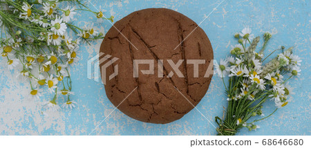 loaf of fresh baked artisan rye and whole grain 68646680