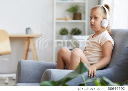 Girl listening to music Girl listening to music 68646692