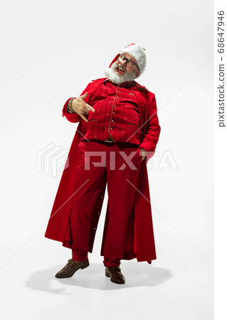 Modern stylish Santa Claus in red fashionable suit isolated on white background Modern stylish Santa Claus in red fashionable suit isolated on white background 68647946