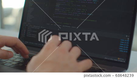 Closeup coding on screen, Man hands coding html and programming on screen laptop, development web, developer. Closeup coding on screen, Man hands coding html and programming on screen laptop, development web, developer. 68648239