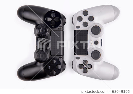 Joystick gaming controller isolated on white background , Video game console developed Interactive Entertainment Joystick gaming controller isolated on white background , Video game console developed Interactive Entertainment 68649305