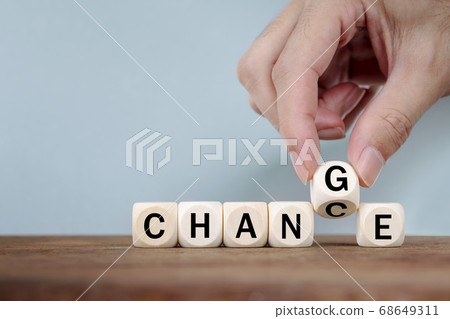 Hand Changing word from CHANCE to CHANGE On Wooden Cube Hand Changing word from CHANCE to CHANGE On Wooden Cube 68649311