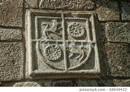 Family coat of arms carved on stone in a medieval chapel Family coat of arms carved on stone in a medieval chapel 68649433