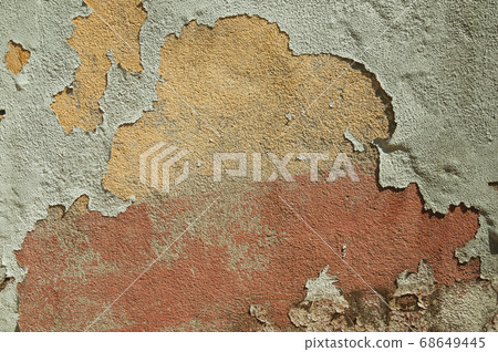 Worn wall with plaster covered by peeled paint Worn wall with plaster covered by peeled paint 68649445
