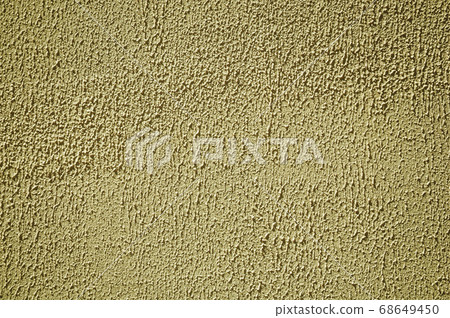 Wall plaster covered by yellow rough paint 68649450