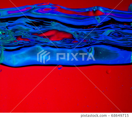 Close up view of the cold and fresh cola with bright bubbles in neon light Close up view of the cold and fresh cola with bright bubbles in neon light 68649715