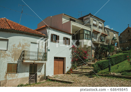 Old houses in small square on slope with steps Old houses in small square on slope with steps 68649845