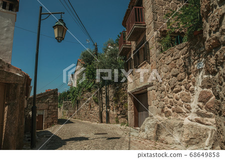 Narrow deserted alley and old houses Narrow deserted alley and old houses 68649858