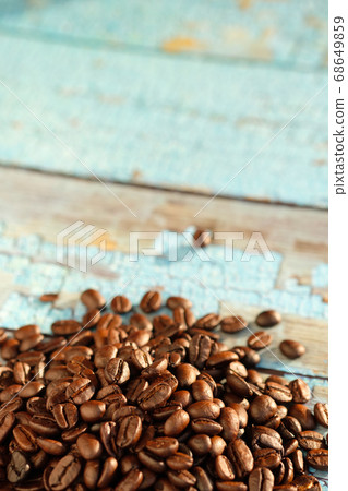 Close up roasted coffee beans on table and copy space. Close up roasted coffee beans on table and copy space. 68649859