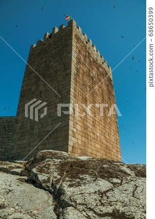 Stone wall and square tower from castle Stone wall and square tower from castle 68650399
