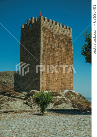 Stone wall and square tower from castle Stone wall and square tower from castle 68650401