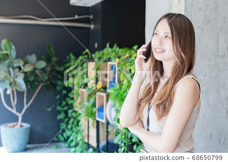 Businesswoman talking on a smartphone Businesswoman talking on a smartphone 68650799