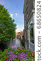 Take a boat along the waterways of the water city Bruges (Belgium) 68650824