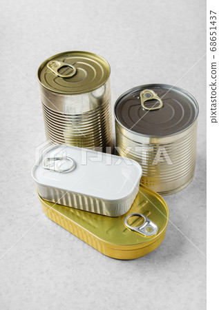 Set of various canned foods in tin cans on kitchen 68651437