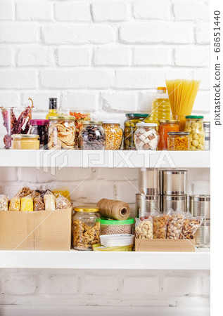 Set of long storage term foods on pantry shelf 68651440