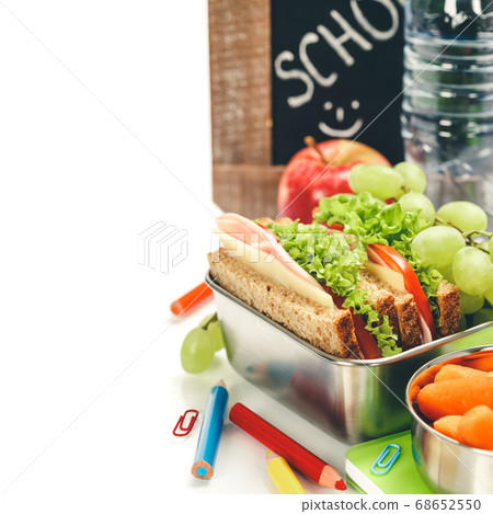 Lunch box with sandwich and fruits infront of chalk board, Lunch box with sandwich and fruits infront of chalk board, 68652550