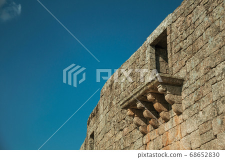 Balcony in gothic style on a wall made of stone wall Balcony in gothic style on a wall made of stone wall 68652830