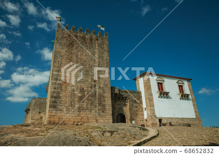 Castle and square tower over rocky hill Castle and square tower over rocky hill 68652832