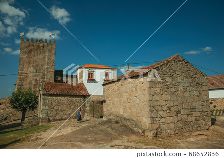 Old woman next to gothic chapels Old woman next to gothic chapels 68652836
