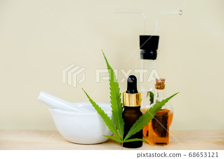 Hemp leaves and CBD oil. Alternative Medicine, Herbal Treatment concept 68653121