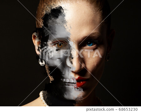 Portrait of woman with Halloween skull make up Portrait of woman with Halloween skull make up 68653230