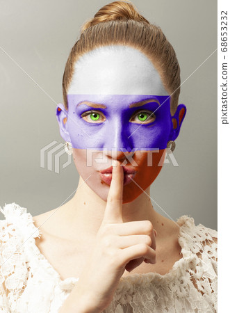 Young woman making a silence gesture with Russian Young woman making a silence gesture with Russian 68653232